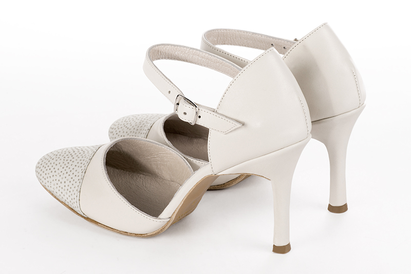 Light silver and off white women's open side shoes, with an instep strap. Round toe. Very high slim heel. Rear view - Florence KOOIJMAN
